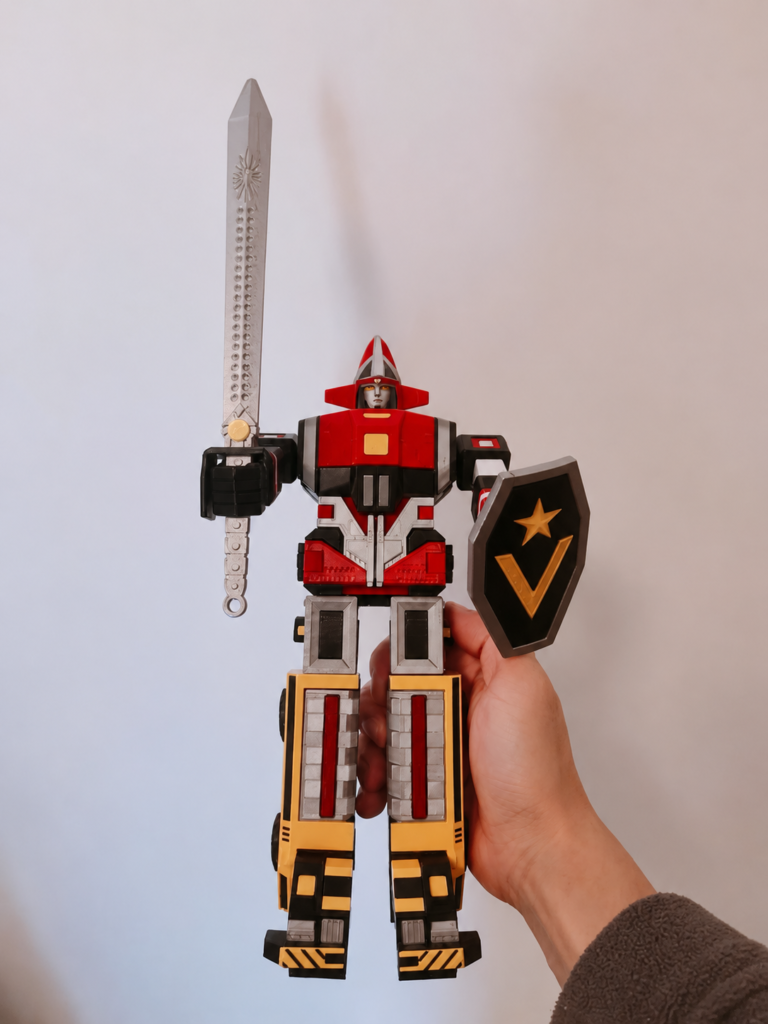 3D-printed Goggle Robo holding a sword and shield